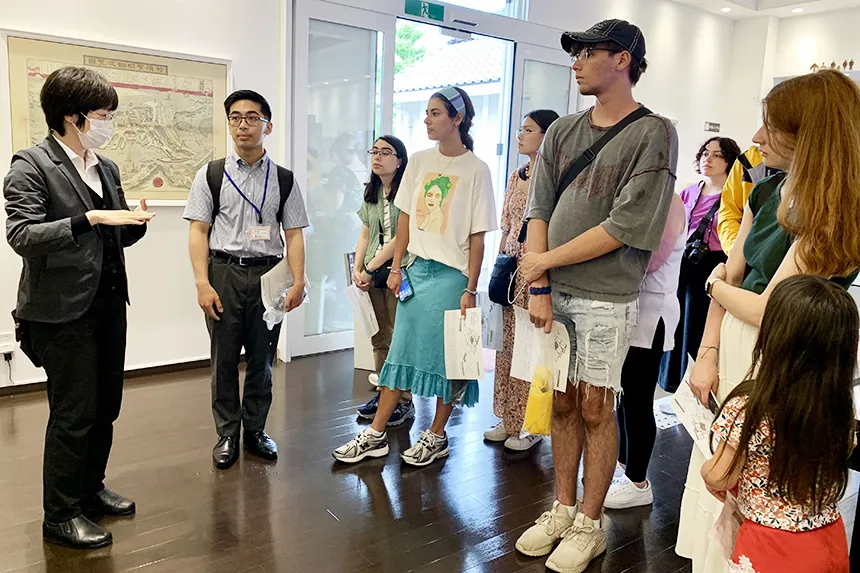 RWU students listen to a guide during a study abroad trip to Japan.