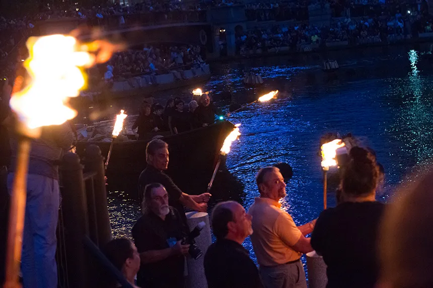 Provost on boat lighting pyres