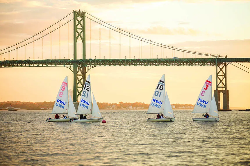 image of RWU Sailing team members at practice in Mount Hope Bay