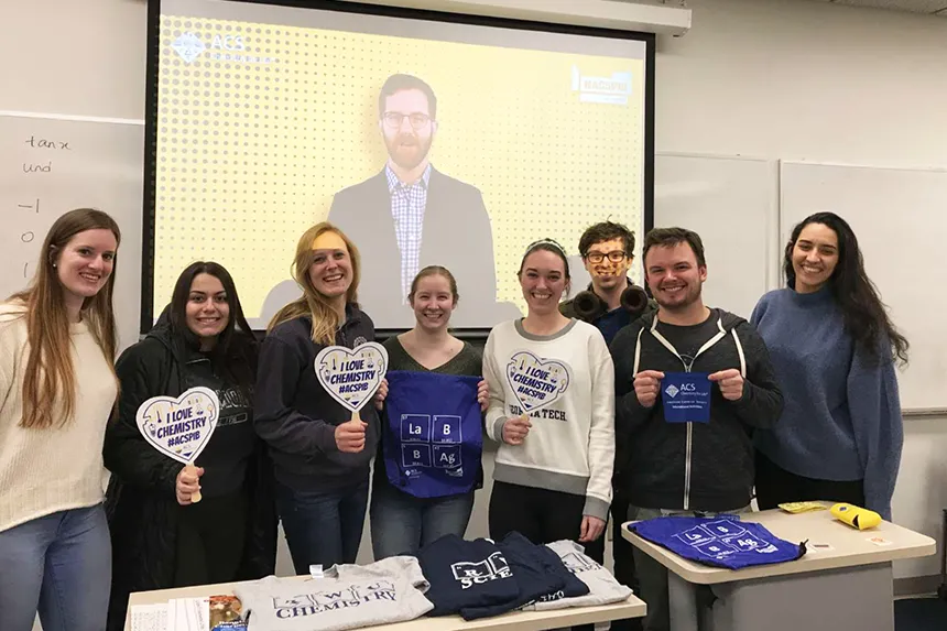 Students pose with live feed