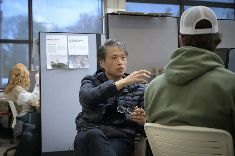 Student collaborating with professor