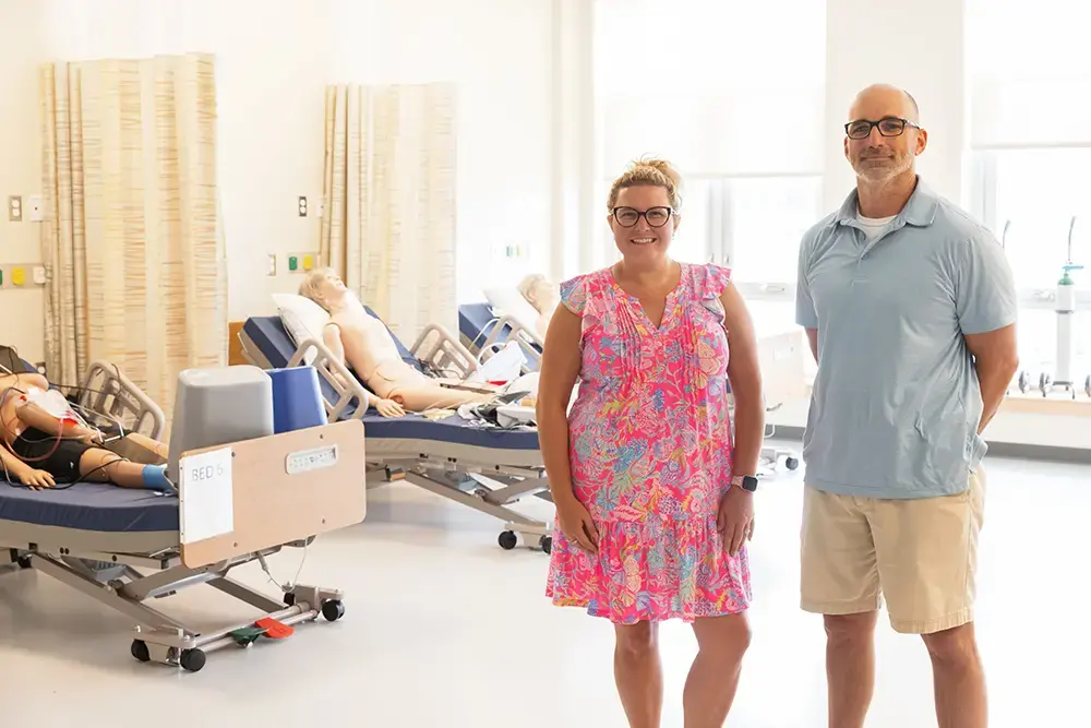 Staff pose with medical dummies