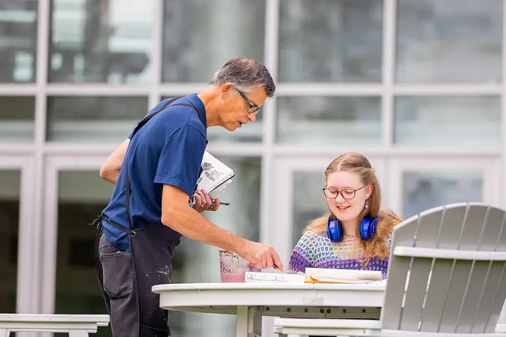 Student receiving guidance from faculty