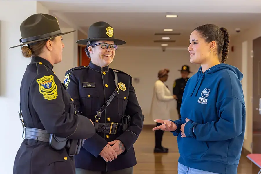 Student talks with RI environmental police