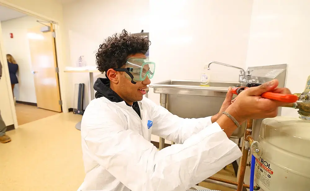 Student practicing plumbing