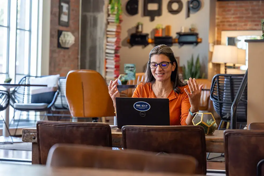 Person engaging in online learning at EXT