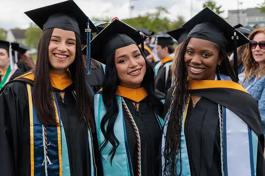 Students pose together at commencement