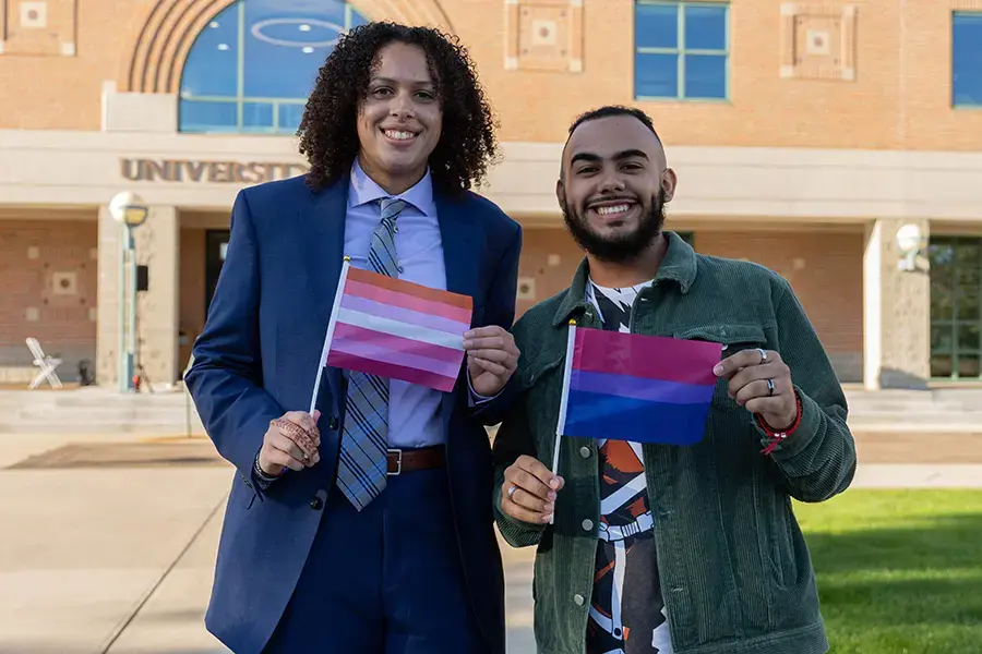 Students hold pride flags