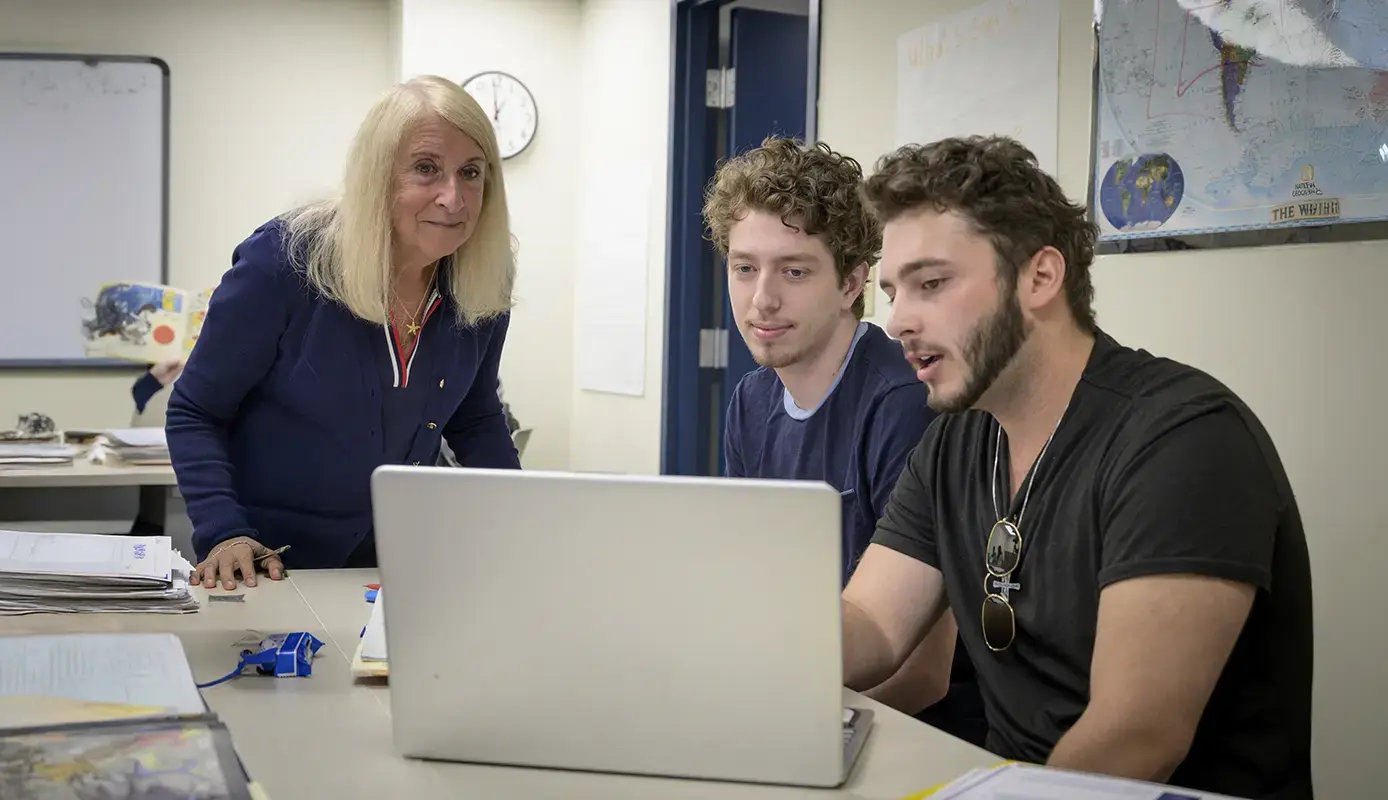 Students working with professor