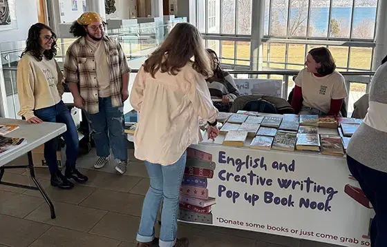 students talking around an events table